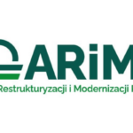 farmer checking tablet field