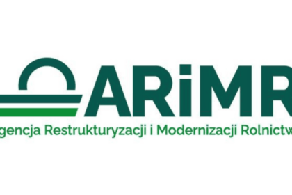 farmer checking tablet field