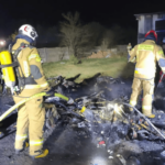 burning caravan night