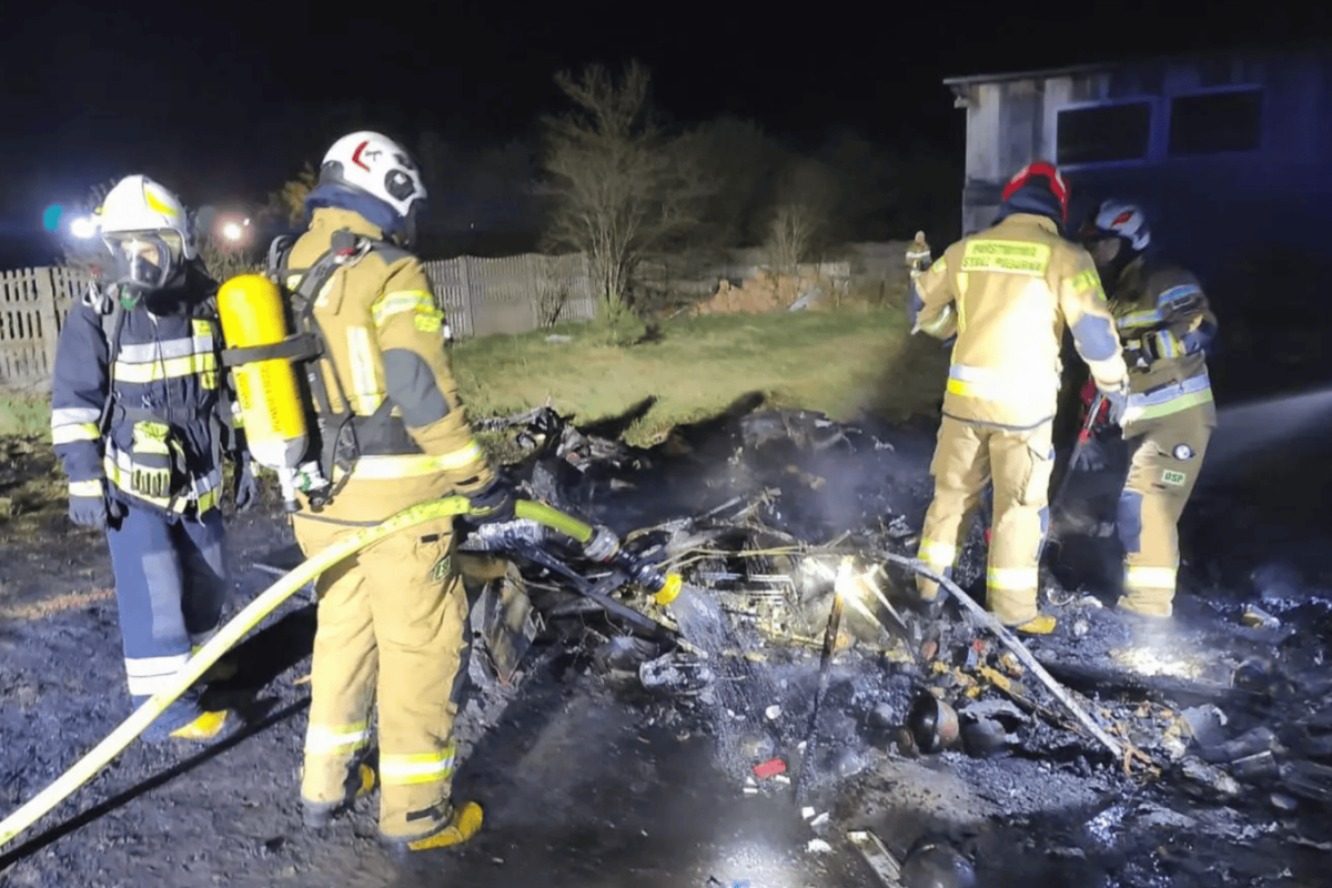 burning caravan night