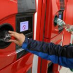 teenager recycling bottles