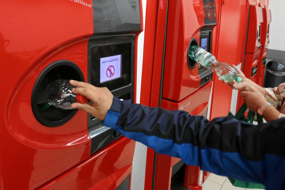 teenager recycling bottles