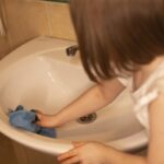 teenager gardening with parents