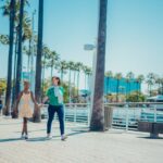 girl walking with mother