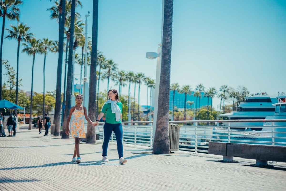 girl walking with mother