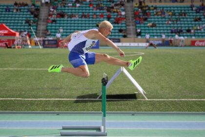 Jakub Szymanski running hurdles