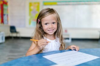 child doing homework in classroom