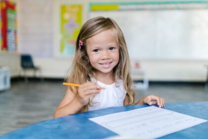 child doing homework in classroom